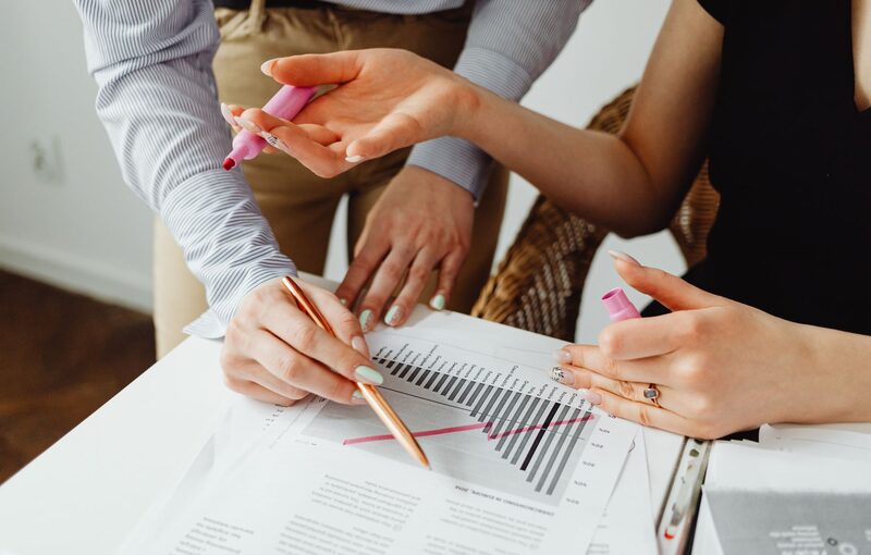 Consultants reviewing workforce data and reports