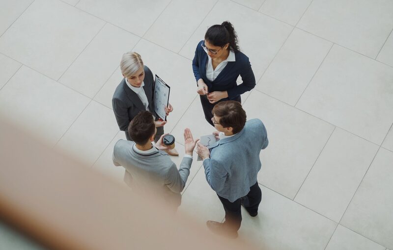 Business team discussing a workforce plan seen from above